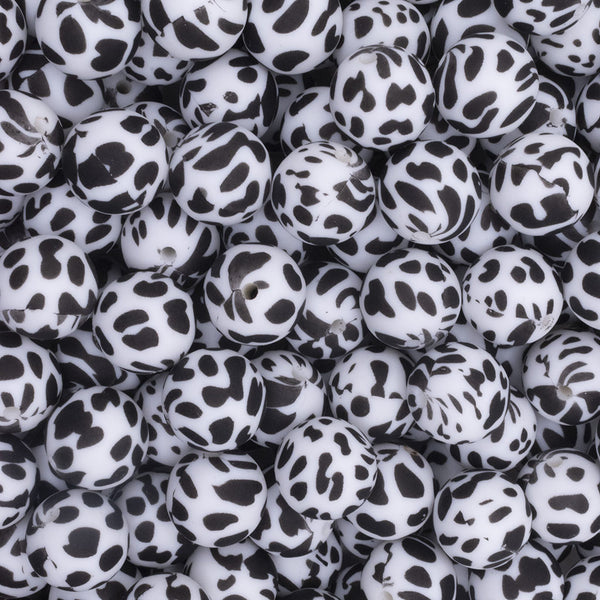 Close up view of a pile of 15mm Cow Print Round Silicone Bead