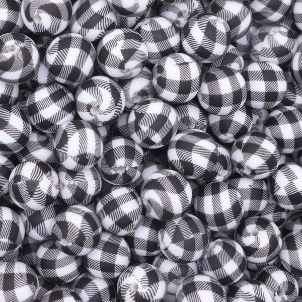 close up view of a pile of 15mm Black and White Plaid Print Round Silicone Bead