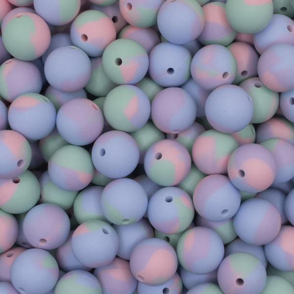 top view of a pile of 15mm Blue and Pink Tie Dyed Print Round Silicone Bead
