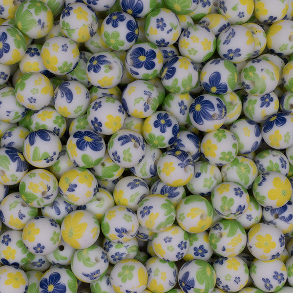 close up view of a pile of 15mm Blue & Green Floral Print Round Silicone Bead