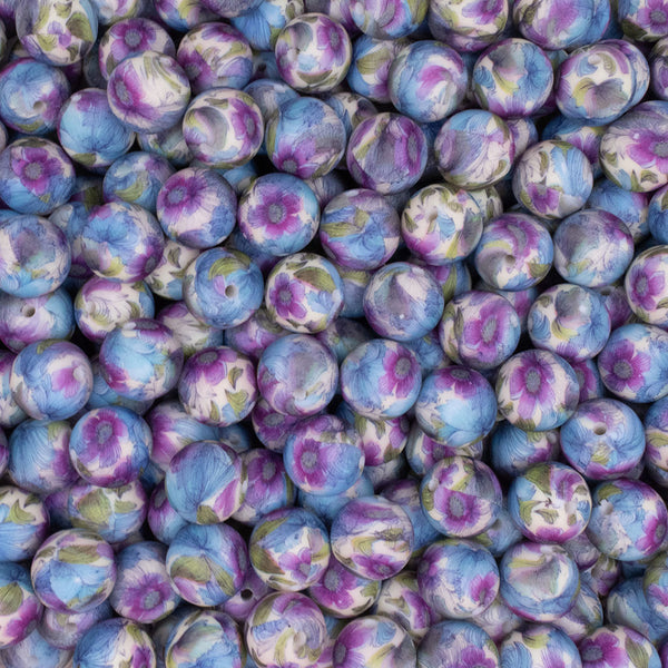close up view of a pile of 15mm Blue & Purple Floral Print Round Silicone Bead