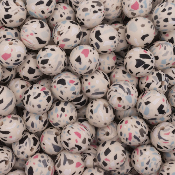 close up view of a pile of 15mm Cream Terrazzo Round Silicone Bead