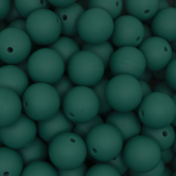 close up view of a pile of 15mm Deep Green Round Silicone Bead