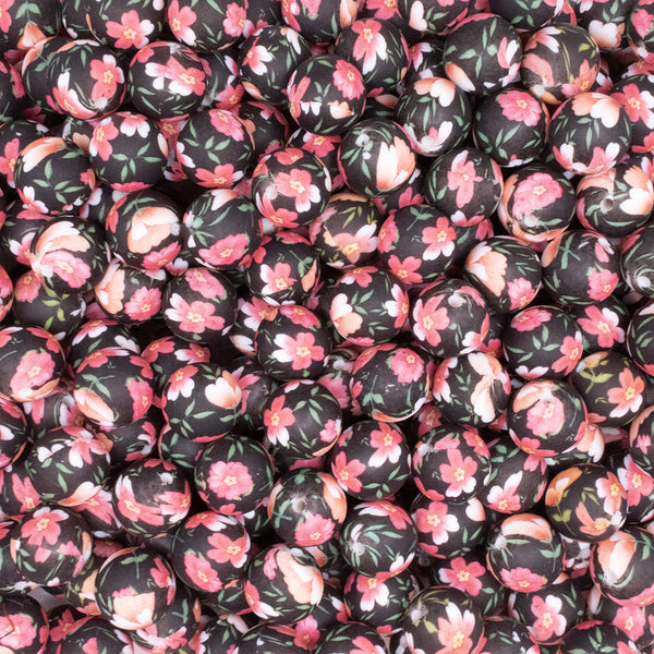 close up view of a pile of 15mm Floral Print on Black Round Silicone Bead