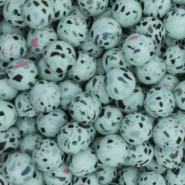 close up view of a pile of 15mm Green Terrazzo Print Round Silicone Bead
