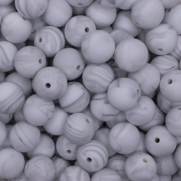 close up view of a pile of 15mm Marble White Round Silicone Bead