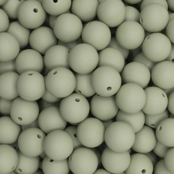 close up view of a pile of 15mm Matcha Green Round Silicone Bead