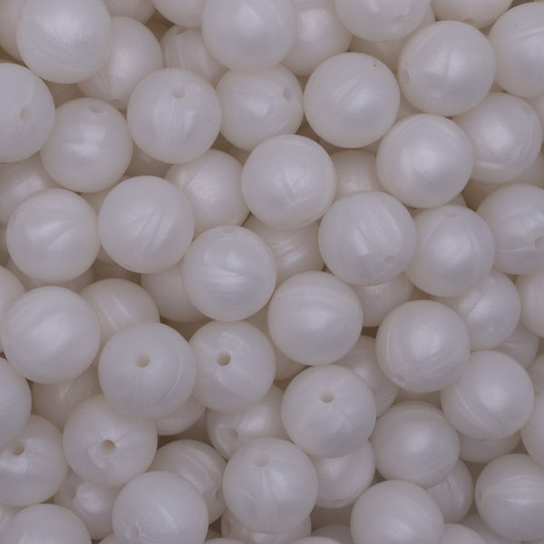 close up view of a pile of 15mm Metallic White Round Silicone Bead