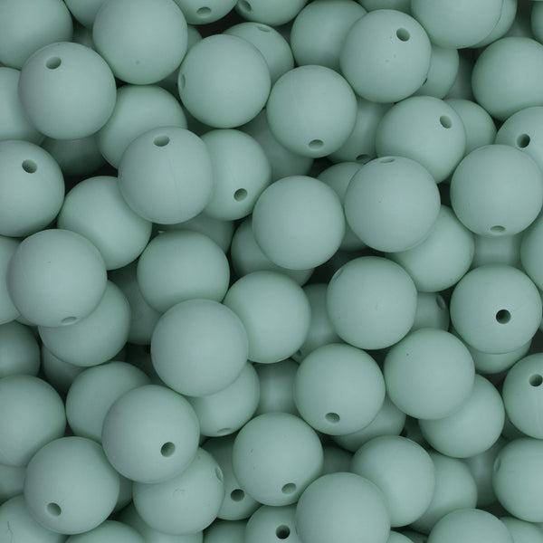 close up view of a pile of 15mm Mint Green Round Silicone Bead