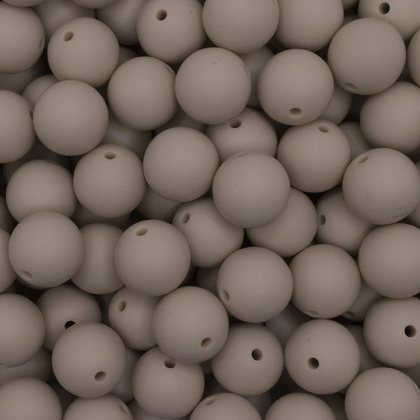 close up view of a pile of 15mm Navajo White Round Silicone Bead