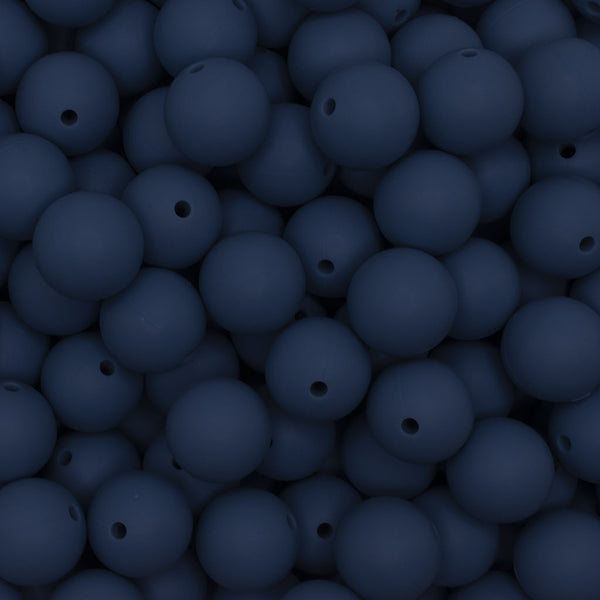 close up view of a pile of 15mm Navy Blue Round Silicone Bead