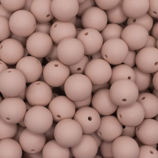 close up view of a pile of 15mm Peach Round Silicone Bead