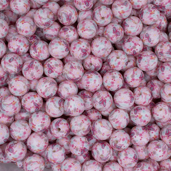 top view of a pile of 15mm Pink Butterfly Print Round Silicone Bead