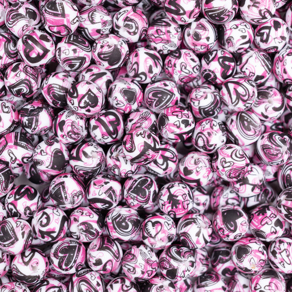 top view of a pile of 15mm Pink Heart Confetti Round Silicone Bead