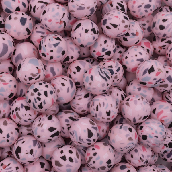 close up view of a pile of 15mm Pink Terrazzo Round Silicone Bead