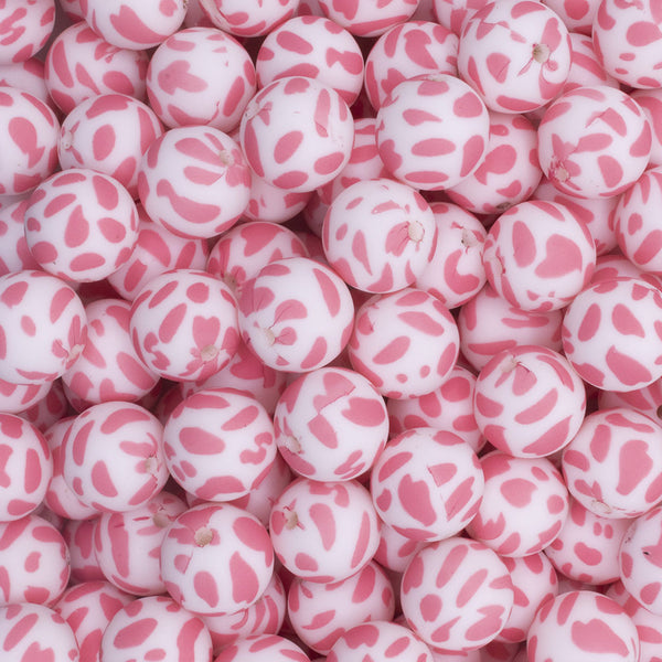 close up view of a pile of 15mm Pink Cow Print Round Silicone Bead