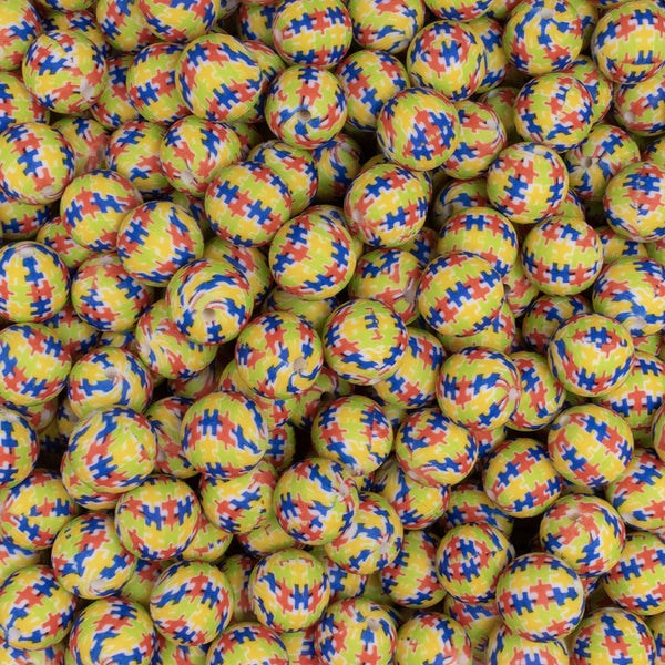 Close up view of a pile of 15mm Puzzle Print Round Silicone Bead