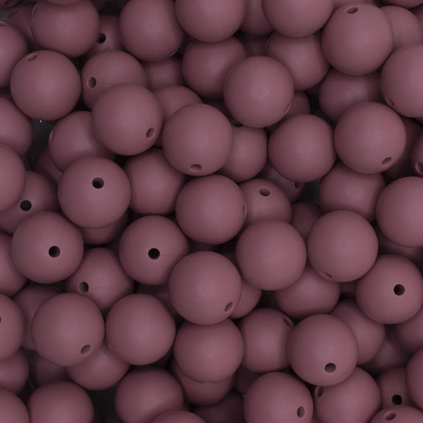 close up view of a pile of 15mm Dark Pink Round Silicone Bead