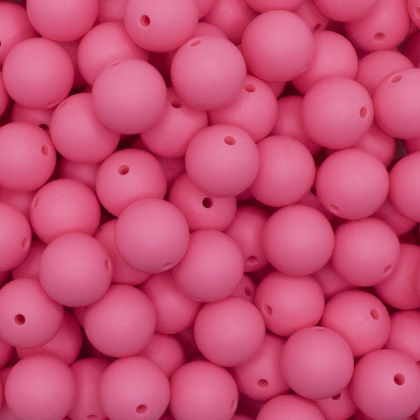 close up view of a pile of 15mm Sakura Pink Round Silicone Bead