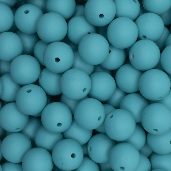 close up view of a pile of 15mm Turquoise Round Silicone Bead