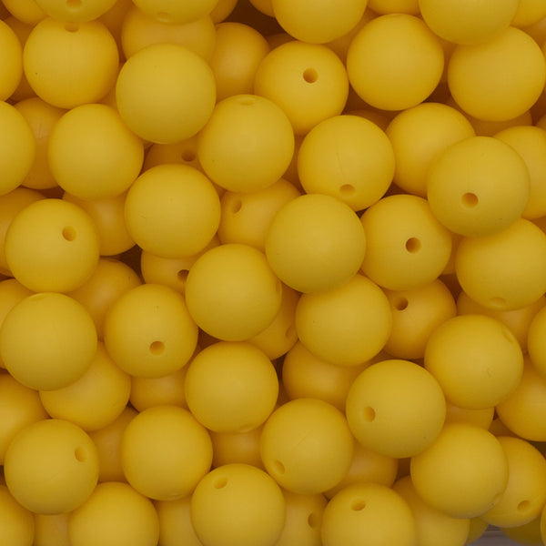 close up view of a pile of 15mm Yellow Round Silicone Bead