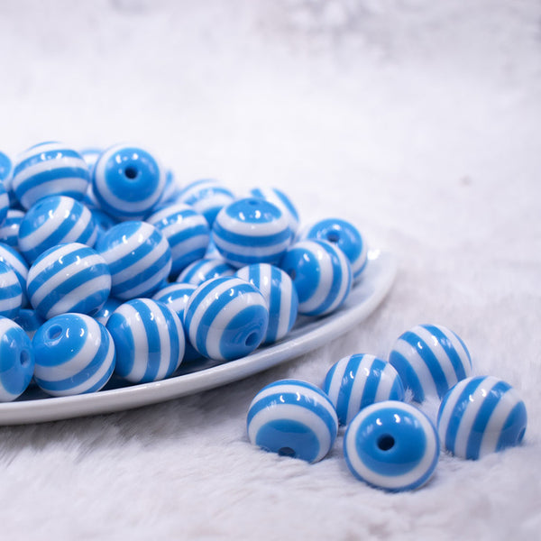 Front view of a pile of 16mm Blue with White Stripe Bubblegum Beads