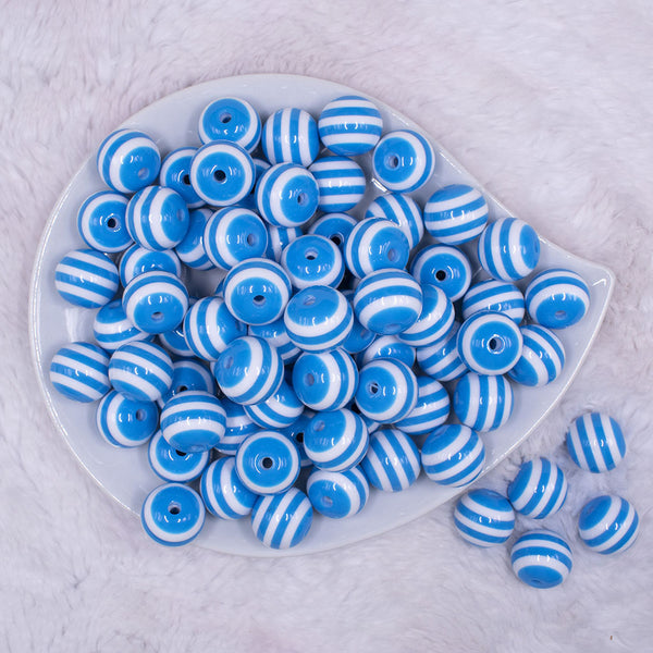 Top view of a pile of 16mm Blue with White Stripe Bubblegum Beads