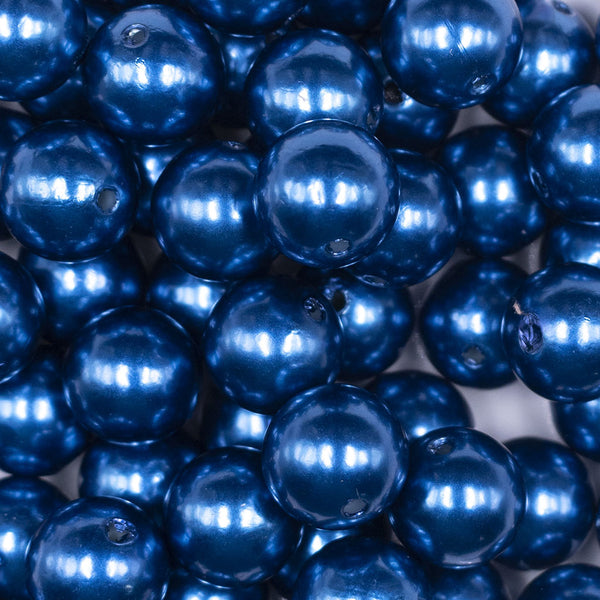Close up view of a pile of 16mm Dark Blue Faux Pearl Acrylic Bubblegum Jewelry Beads