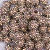Close up view of a pile of 16mm Gold Shimmer Rhinestone AB Chunky Bubblegum Jewelry Beads