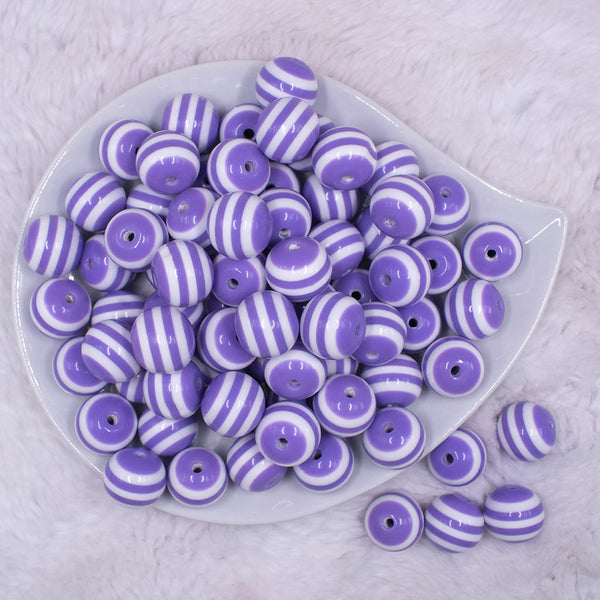 Top view of a pile of 16mm Purple with White Stripe Bubblegum Beads