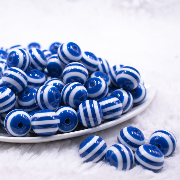 Front view of a pile of 16mm Royal Blue with White Stripe Bubblegum Beads