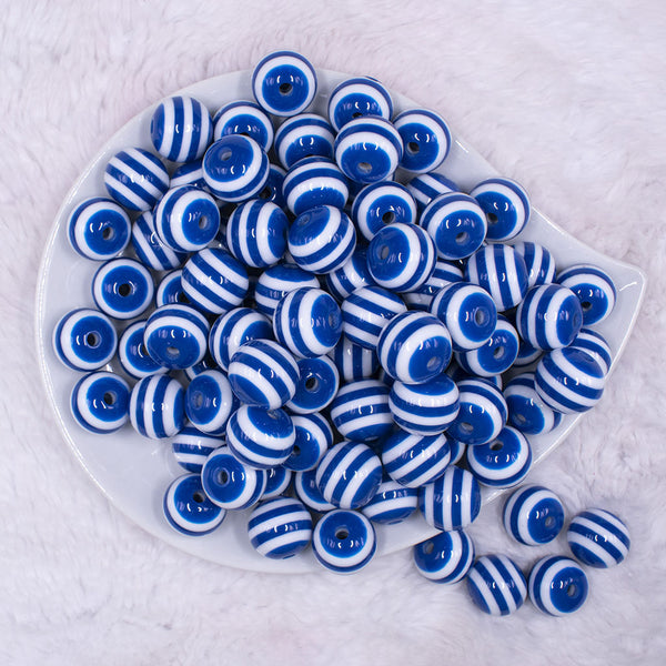 Top view of a pile of 16mm Royal Blue with White Stripe Bubblegum Beads