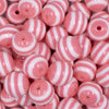 Close up view of a pile of 16mm Salmon Pink with White Stripe Bubblegum Beads