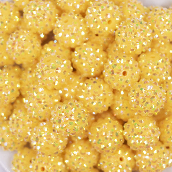Close up view of a pile of 16mm Yellow Rhinestone AB Chunky Bubblegum Jewelry Beads