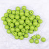 Top view of a pile of 16mm Apple Green Solid Acrylic Bubblegum Jewelry Beads
