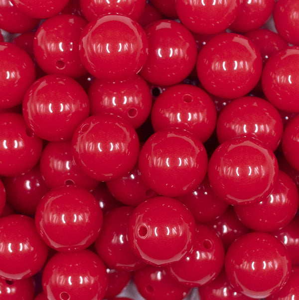 Close up view of a pile of 16mm Apple Red Solid Acrylic Bubblegum Jewelry Beads