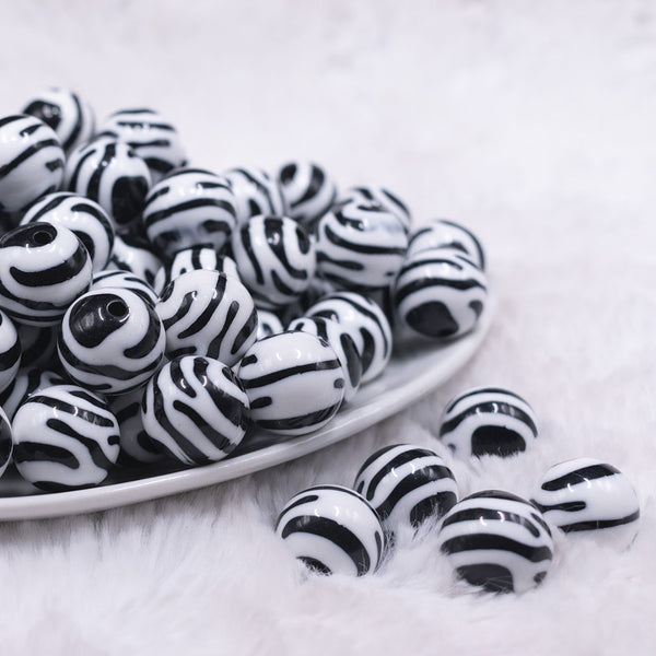 Front view of a pile of 16mm Zebra Print Acrylic Bubblegum Jewelry Beads