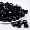 front view of a pile of 16mm Black Faceted Bubblegum Beads