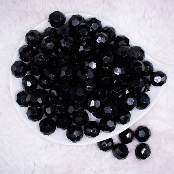 top view of a pile of 16mm Black Faceted Bubblegum Beads