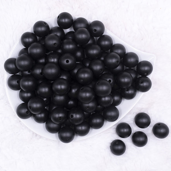 Top view of a pile of 16mm Black Matte Pearl Acrylic Bubblegum Jewelry Beads