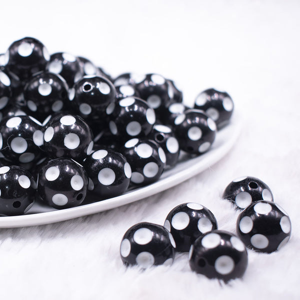 front view of a pile of 16mm Black with White Polka Dots Bubblegum Beads