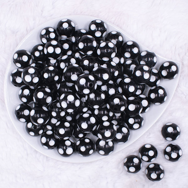 top view of a pile of 16mm Black with White Polka Dots Bubblegum Beads