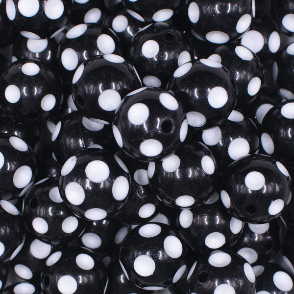 close up view of a pile of 16mm Black with White Polka Dots Bubblegum Beads