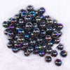 top view of a pile of 16mm Smoked Neochrome Black Solid AB Bubblegum Beads