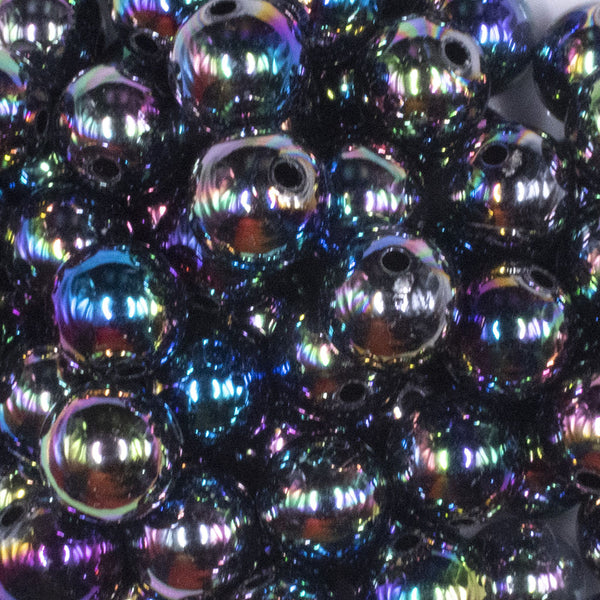 close up view of a pile of 16mm Smoked Neochrome Black Solid AB Bubblegum Beads
