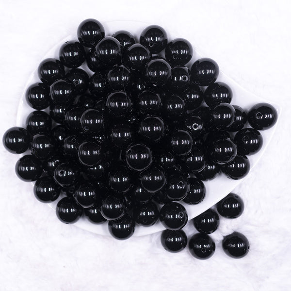 Top view of a pile of 16mm Black Solid Acrylic Bubblegum Jewelry Beads