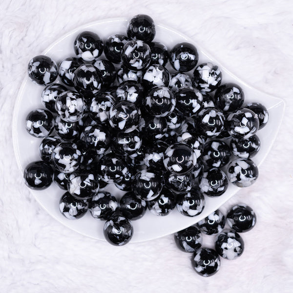top view of a pile of 16mm Black Tablet Acrylic Bubblegum Beads