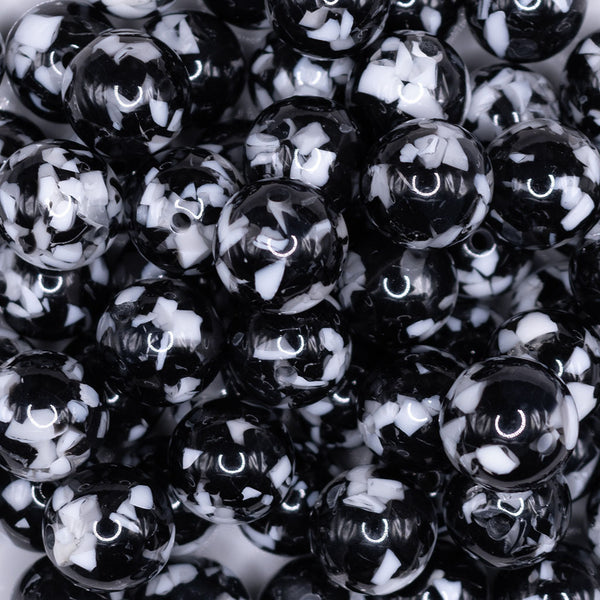 close up view of a pile of 16mm Black Tablet Acrylic Bubblegum Beads