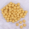Top view of a pile of 16mm Blonde Yellow Solid Acrylic Bubblegum Jewelry Beads