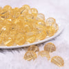 front view of a pile of 16mm Blonde Yellow Transparent Faceted Shaped Bubblegum Beads